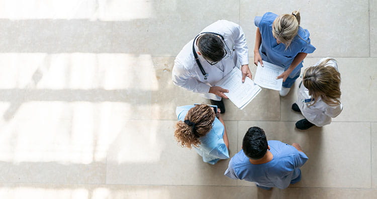 professionals standing in circle